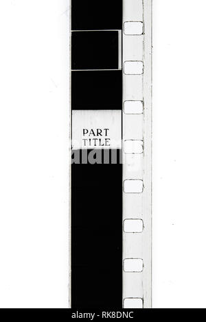 Extreme close up of 8mm movie film strip with title text message on frame Stock Photo