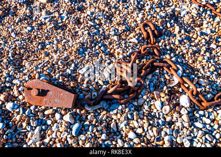 Iron Chain Background Poster - the chain used to attach the bulldozer which pulls or pushes the Hastings Fishing Fleet to and from the sea Stock Photo