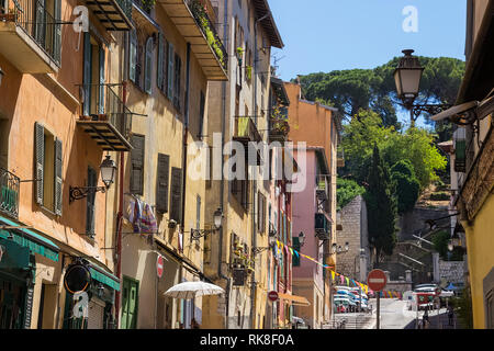 Narrow street in old part of Nice - fifth populous city and one of the most visited in France. Stock Photo