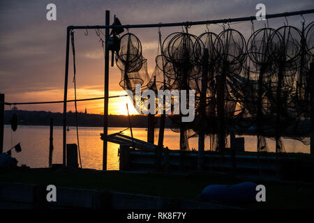 A fish trap is a stationary trap used for fishing. Stock Photo