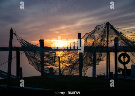 A fish trap is a stationary trap used for fishing. Stock Photo