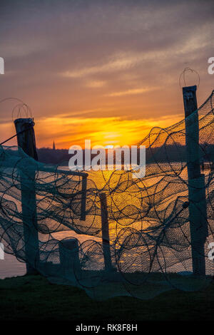 A fish trap is a stationary trap used for fishing. Stock Photo