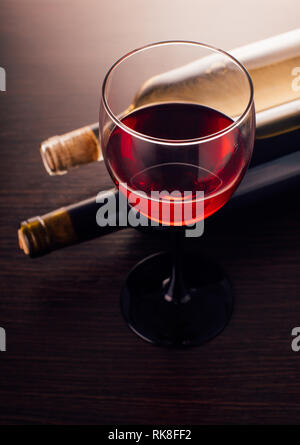 wine glasse and bottles on a wooden background Stock Photo