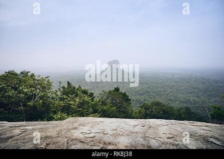 Sigiriya Rock (UNESCO World Heritage Site). View from Pidurangala Rock in Sri Lanka. Stock Photo