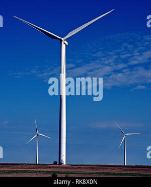 A wind turbine at the Spearville Wind Farm towers above a grain ...