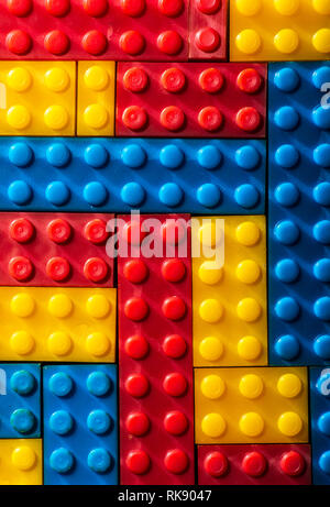Plastic geometric cubes. Construction toy solid background from designer constructor. Multi-colored cubes. Geometric background. Children's toy. Circl Stock Photo