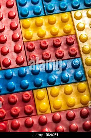 Plastic geometric cubes. Construction toy solid background from designer constructor. Multi-colored cubes. Geometric background. Children's toy. Circl Stock Photo