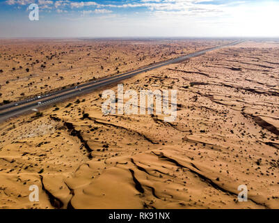 Desert landscape crossed by a road aerial view Stock Photo