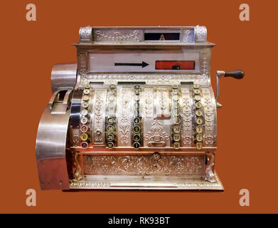 Old-time cash register, isolated on background. Vintage cash register. Stock Photo