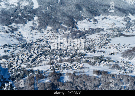 The Romantic, Snow Covered Skiing Resort of Cortina d' Ampezzo in the Italian Dolomites seen from Faloria embedded in a beautiful Winter Landscape. Stock Photo