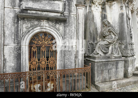 Old european cemetery weathered woman statue Stock Photo