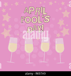Text sign showing April Fool S Is Day. Conceptual photo fixed date that has occasion for playing tricks Filled Cocktail Wine Glasses with Scattered St Stock Photo