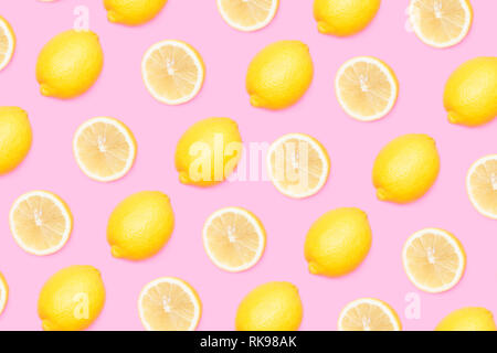 Yellow lemons pattern on pink background Stock Photo