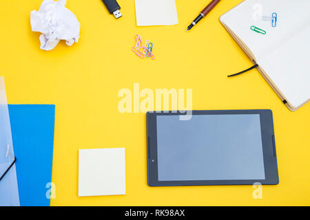 Black tablet with the office supplies Stock Photo