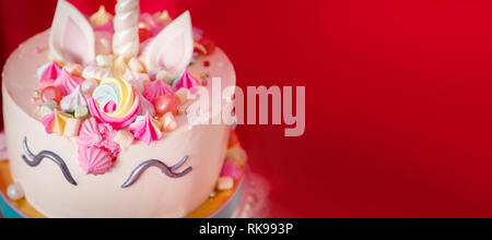 Sweet table and big unicorn cake for baby girl first birthday. Free space for text Stock Photo