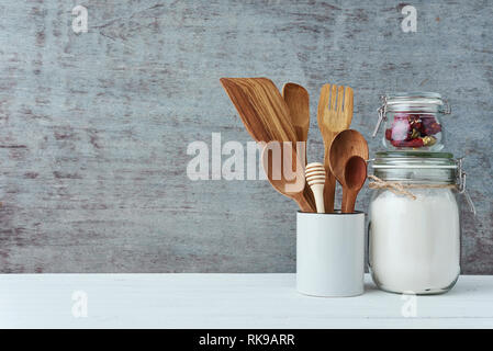 Kitchen utensils in ceramic cup on gray background, copy space Stock Photo