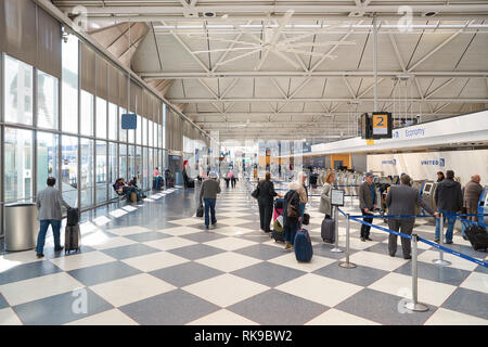 CHICAGO - APRIL 05, 2016: inside of O'Hare International Airport. O'Hare is currently a major hub for American Airlines and United Airlines, as well a Stock Photo