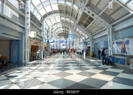 CHICAGO - APRIL 05, 2016: inside of O'Hare International Airport. O'Hare is currently a major hub for American Airlines and United Airlines, as well a Stock Photo