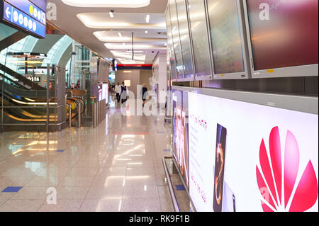 DUBAI, UAE - CIRCA JUNE, 2015: inside of Dubai International Airport. Dubai International Airport is the primary airport serving Dubai, United Arab Em Stock Photo