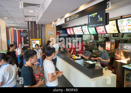 SHENZHEN, CHINA - MAY 06, 2016: inside of McDonald's restaurant. McDonald's is the world's largest chain of hamburger fast food restaurants, founded i Stock Photo