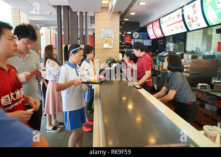 SHENZHEN, CHINA - MAY 06, 2016: inside of McDonald's restaurant. McDonald's is the world's largest chain of hamburger fast food restaurants, founded i Stock Photo