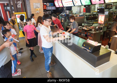 SHENZHEN, CHINA - MAY 06, 2016: inside of McDonald's restaurant. McDonald's is the world's largest chain of hamburger fast food restaurants, founded i Stock Photo