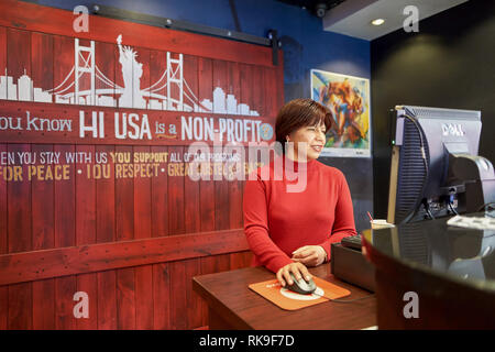 NEW YORK - CIRCA MARCH, 2016: reception in the hostel. Hostels provide budget-oriented, sociable accommodation where guests can rent a bed, usually a  Stock Photo