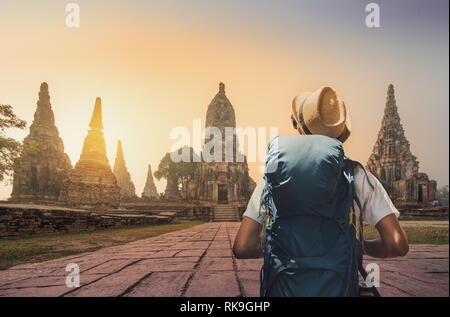 Tourists With an Elephant at Wat Chaiwatthanaram temple in Ayutthaya Historical Park, a UNESCO world heritage site in Thailand Stock Photo