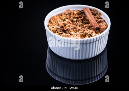 Healthy dessert, baked apple with crunch. Stock Photo