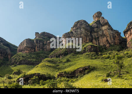 Eroded rock formations decorate a hill on the Tugela Gorge hike on the Amphitheatre mountain in the Drakensberg, South Africa Stock Photo