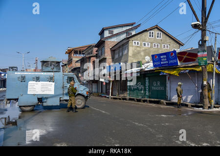 Srinagar, India. 9th Feb 2019. Indian paramilitary forces seen guarding a street at downtown during restrictions in Srinagar. Restriction on the movement of vehicles were imposed protectively in parts of Srinagar as separatist groups called for a strike on the anniversary of execution of Afzal Guru, a Kashmiri who was convicted and given a death sentence for his role in the 2001 attack on Indian Parliament. Credit: SOPA Images Limited/Alamy Live News Stock Photo