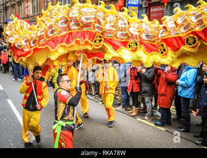 London, UK 10th Feb 2019. The performers make their way through Soho. London's Chinese New Year celebrations, the largest outside Asia, take place with colourful parades, lion and dragon dances, a procession through Soho, cultural performances and displays in and around Chinatown, the West End and Trafalgar Square. 2019 welcomes the Year of the Pig. Credit: Imageplotter News and Sports/Alamy Live News Stock Photo
