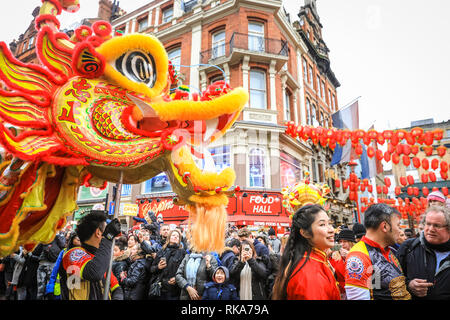 London, UK 10th Feb 2019. The performers make their way through Soho. London's Chinese New Year celebrations, the largest outside Asia, take place with colourful parades, lion and dragon dances, a procession through Soho, cultural performances and displays in and around Chinatown, the West End and Trafalgar Square. 2019 welcomes the Year of the Pig. Credit: Imageplotter News and Sports/Alamy Live News Stock Photo