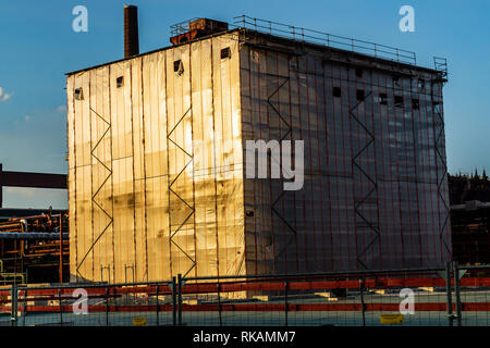 ESSEN, GERMANY, JULY 13, 2018: cover on construction site reflecting sun at sunset Stock Photo