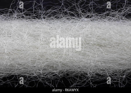 extreme close-up of a white woolen thread Stock Photo