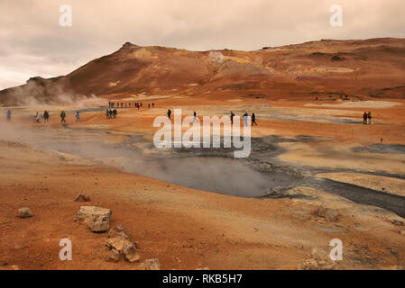 Boiling mud pots at Namafjall, a popular tourist spot in Iceland. Stock Photo