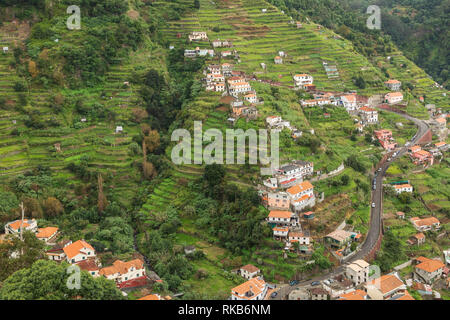 An image showing how steps have been cut into the mountainous landscape so that local people can grow their crops shot at Machico, Madeira, Portugal Stock Photo