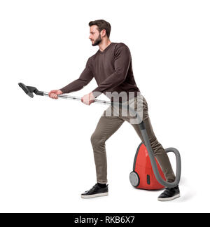 Side view of a man holding a vacuum cleaner tube on white background Stock Photo