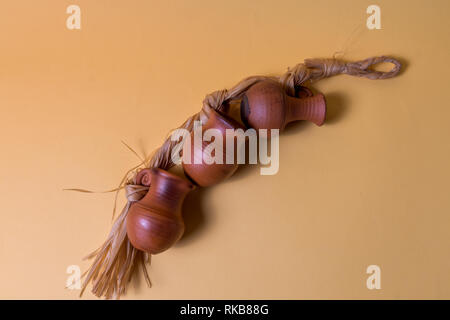 Brown small Clay Jugs on yellow background and copy space for text, horizontal. Stock Photo
