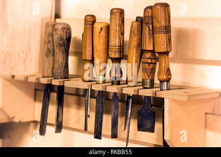 Old used wood lathe chisels selection at carpentry workshop Stock Photo