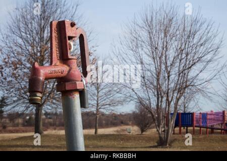 Warminster, Pennsylvania, USA - February 6, 2019: Water fountain at a community park occupying the site of a former naval air base. Stock Photo