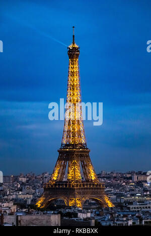 The Eiffel Tower illuminated at night as seen from the Top Of  The Arc de Triomphe de l'Étoile on a Summer night in Paris Stock Photo