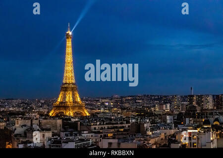 The Eiffel Tower illuminated at night as seen from the Top Of  The Arc de Triomphe de l'Étoile on a Summer night in Paris Stock Photo