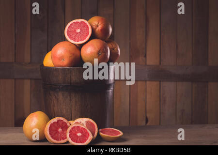 grapefruit basket still life on wooden background Stock Photo
