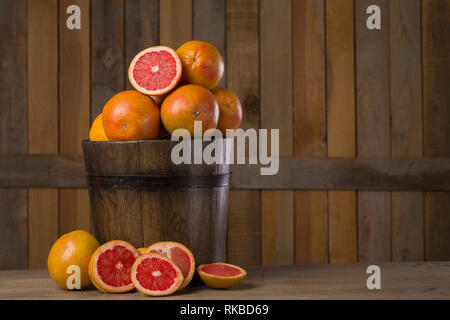 grapefruit basket still life on wooden background Stock Photo