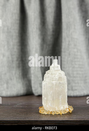 Naturally carved mineral stone Selenite tower has healing on cleansing properties. Also used for recharging other mineral crystal stones. Stock Photo