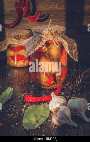Homemade fermented products from fried eggplant in glass jars for long storage Stock Photo