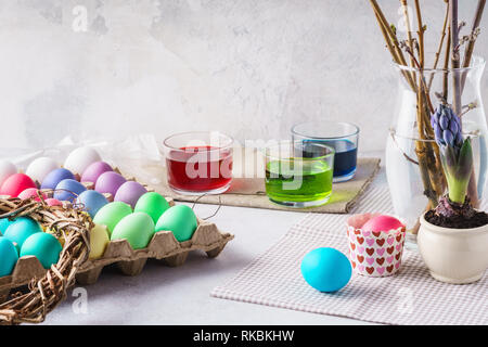 Painting eggs for Easter. Colorful eggs, paints and decoration. Stock Photo