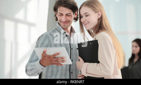 closeup.Office workers looking at tablet computer. people and technology. Stock Photo