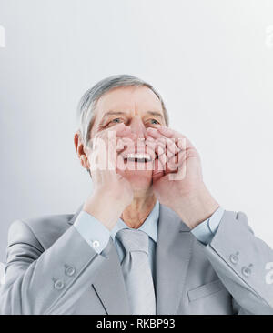 smiling Mature businessman shouting.isolated on blurred background. Stock Photo